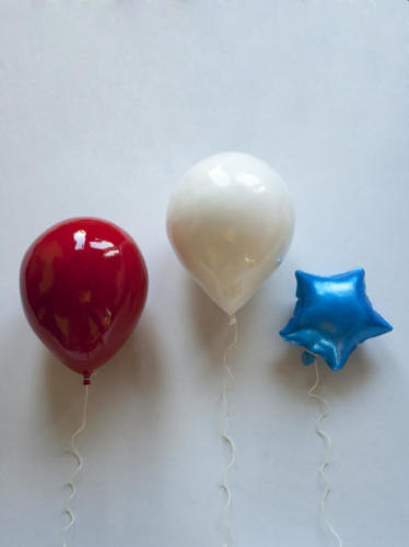 Datset balloons say Happy Birthday to America